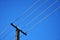 Power pylon cable under blue sky