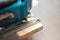 Power tool. Image of electric  fretsaw in action. Machine saw with a fine blade