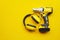 Power tools,Ear Muffs, Mid-Range Cordless Impact Wrench on yellow background .Safety Equipment concept