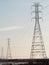 Power towers in light blue sky