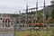 Power transformer station in  district town  Zarnovica, Slovakia Europe, surrounded by a metal fence with massive gate.