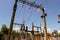 Power transmission concrete towers with electric garland of insulators on transformer station