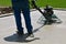 Power trowel smoothening drying concrete on a garage floor