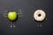 Power of vitamins diet abstract concept with green muscles  apple on blackboard