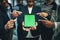 Power your business further with these smart apps. a group of businesspeople pointing to a digital tablet with a chroma