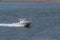 Powerboat cruising up Acushnet River