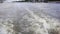 Powerboat moving. view from stern of ship with water foam and surface behind. Motor boat floating on Moscow river