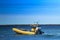 Powerboat sailing through the deep waters of Lake Huron, ON