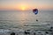 Powered paraglider flying over the sea