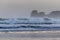 Powerful breaking waves on surf spot in hendaye in winter morning sunrise, basque country, france