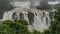 Powerful cascades of waterfalls. Streams of water collapse from ledges, foaming.