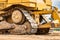 Powerful crawler bulldozer close-up at the construction site. Construction equipment for moving large volumes of soil. Modern