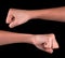 Powerful fist pump against black background