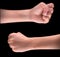 Powerful fist pump against black background