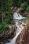 Powerful forest waterfall in High Tatra mountains