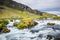 Powerful and magestic waterfall with volcanic rock in an Icelandic landscape2