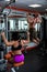 Powerful, muscular, strong, guy and girl, train back. The guy performs pull-UPS, the girl makes a craving for the head