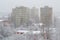 Powerful snow storm in Bucharest, Romania, with tall apartment buildings barely visible from the rapidly falling snow flakes