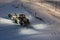 Powerful snowplough clearing parking lot