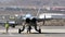 Powerful supersonic fighter plane with two jet engines seen from behind