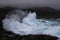 Powerful Surf Breaking with Spray on Rocky Coast