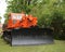 Powerful tractor with a bucket in front is prepared for road repair work