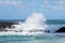 Powerful waves flow over rocks at Lumahai Beach, Kauai