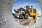 Powerful wheel loader or bulldozer working on a quarry or construction site. Earthworks in construction. Powerful modern equipment