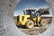 Powerful wheel loader or bulldozer working on a quarry or construction site. Earthworks in construction. Powerful modern equipment