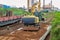 A powerful wheeled excavator prepares the site for the construction of the railway. Excavator with a wide bucket leveling the