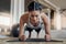 Powering through. Full length shot of an attractive young female athlete planking in the gym.