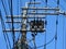 Powerline insulators, connectors and tangled wires on an electrical pole