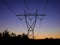 Powerlines Silhouetted Against Clear Skies at Sunset