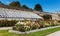 Powerscourt garden, with rows of flowers and greenhouse, Ireland