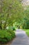 POZNA, POLAND - Sep 11, 2020: Footpath along green trees and grass