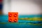 POZNAN, POLAND - Mar 19, 2016: Orange Lego Duplo brick on a carpe