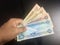 PPaying United Arab Emirates dirham currency notes
