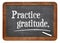 Practice gratitude on blackboard