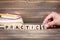 Practice. Wooden letters on the office desk