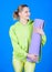 Practicing yoga every day. Girl slim fit athlete hold fitness mat. Fitness and stretching. Stretching muscles. Dedicated