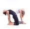 Practicing Yoga exercises in group / Camel Pose - Ustrasana