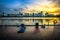 Practicing Yoga at Stadium Riverside Walk of Singapore Sports Hub. It is a sports and recreation district in Kallang, Singapore.