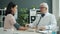 Practitioner examining patient checking blood pressure and pulse during medical visit