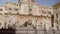 Praetorian fountain in Piazza Pretoria, Birds fly to drink water from