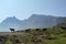 Pragser Wildsee - A few silhouettes of heard of sheep grazing on the lush green pasture in Italian Dolomites on a sunny day