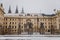 Prague Castle from Hradcany Square, Main entrance to the courtyard, green street lanterns looks like candelabra, snow in winter