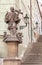 Prague castle steps with a religious statue