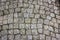 Prague cobblestone gray beige paving stone square background