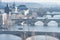 PRAGUE, CZECH - MARCH 14, 2016: Cityscape of Prague with Lvtana River and Charles Bridge. Flying Swan in Background