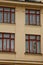 Prague, Czech Republic. 10.05.2019: Close-up view of the facade with windows of old historical buildings in Prague. Retro, old-